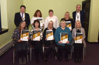 Pictured: Provost Bissett and Chief Executive Kenneth Lawrie with employees from Social Work Adult Services